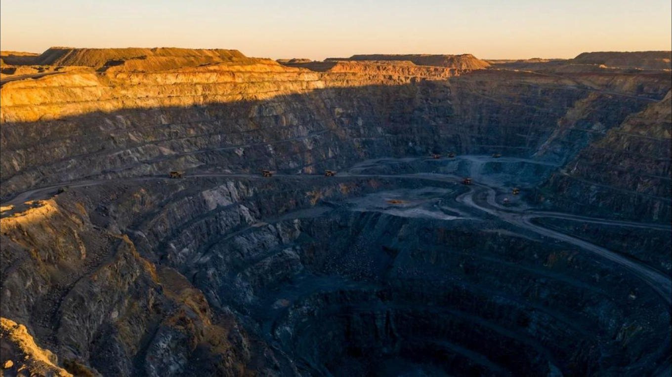 Open-pit mining operation at golden hour